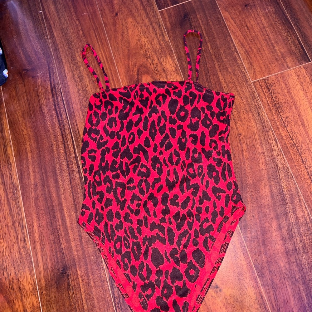 Zebra and red body suit